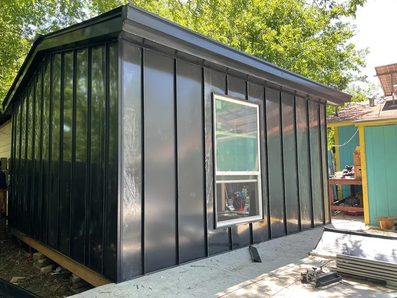 Black standing seam metal wall panels for Metal Roof Installation in McLendon-Chisholm