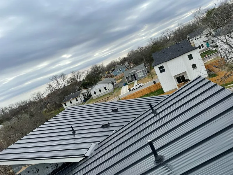 Standing seam metal roof panels with vents for Skylight Repair in McLendon-Chisholm
